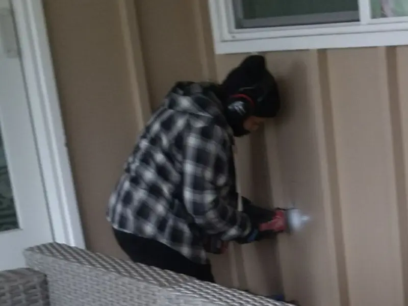 Professional electrician installing an exterior outlet in Bedminster