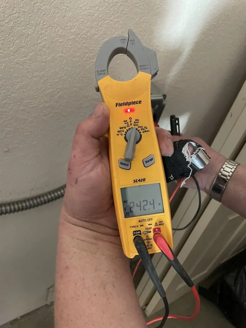 Voltage testing with clamp meter during Electrical Installation Services in Bedminster
